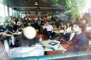 Logic Lounge at Heuer am Karlsplatz: Over a 100 guests enjoying the conversation between Christos Papadimitriou and Helmut Veith on the pancake stacking problem (as solved together with Bill Gates) and the nexus of sex and algorithms